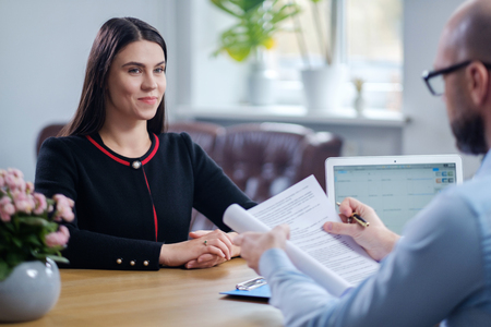 Beautiful brunette woman attending job interview
