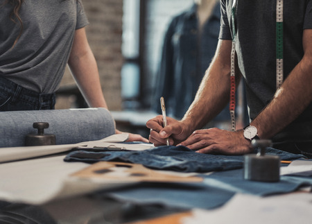 Fashion designer working in his studioの写真素材
