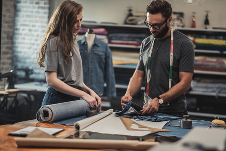 Fashion designer working in his studioの写真素材