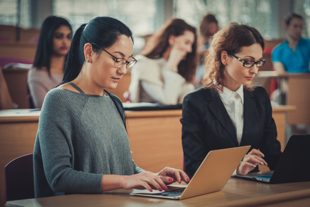 Multinational group of students in an auditoriumの写真素材