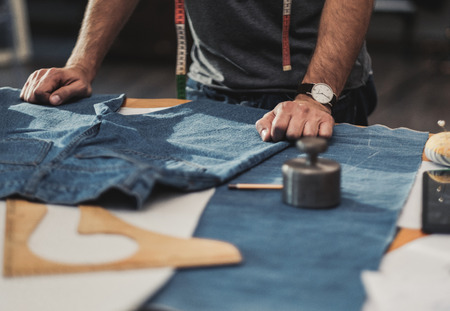 Fashion designer working in his studioの写真素材