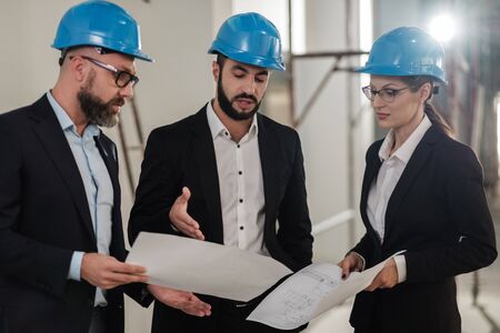 Engineers in hardhats have conversationの写真素材
