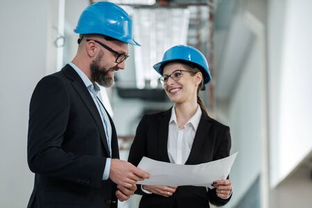 Engineers in hardhats have conversationの写真素材