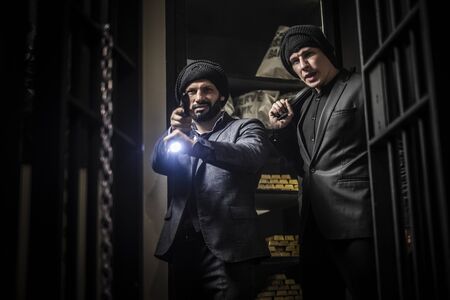 Two ardmed men robbing a bankの写真素材