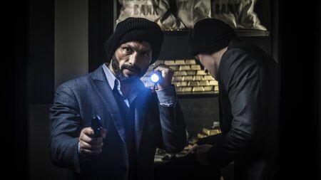 Two ardmed men robbing a bankの写真素材