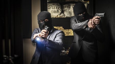 Two ardmed men robbing a bankの写真素材
