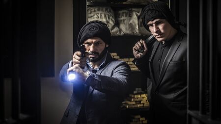 Two ardmed men robbing a bankの写真素材