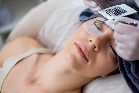 Procedure of eyelash extension in salon by cosmeticianの写真素材
