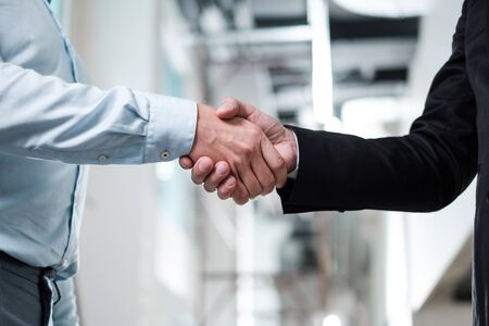 Business people shaking hands as a sign of agreementの写真素材