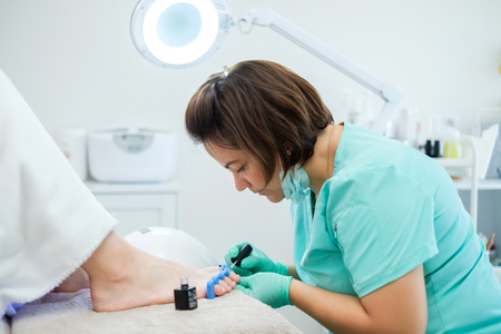 Woman having pedicure at beauty salonの写真素材