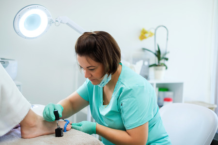 Woman having pedicure at beauty salonの写真素材