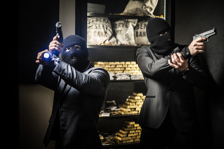 Two ardmed men robbing a bankの写真素材