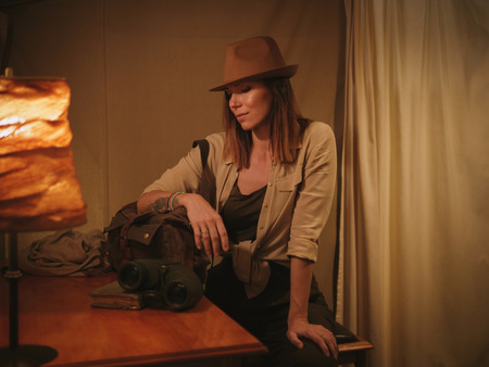Beautiful woman in a tent at savanna, Kenyaの写真素材