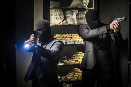 Two ardmed men robbing a bankの写真素材