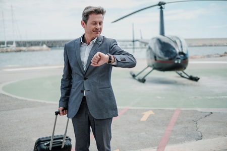 Businessman standing near private helicopterの写真素材
