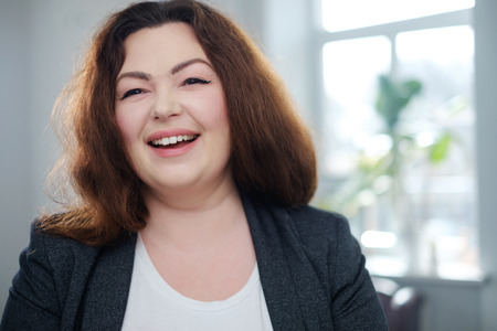 Portrait of a cheerful plus size modelの写真素材