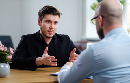 Confident young man attending job interviewの写真素材