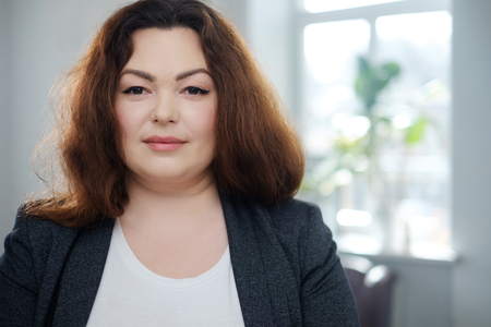 Portrait of a cheerful plus size modelの写真素材