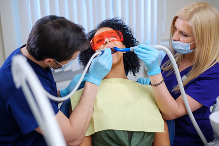 Dentist and his assitant working in private practiceの写真素材