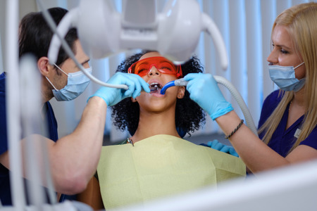 Dentist and his assitant working in private practiceの写真素材