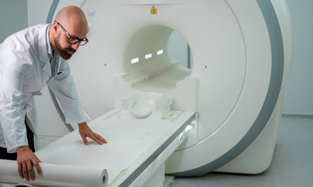 Doctor preparing MRI scanner in a hospitalの写真素材