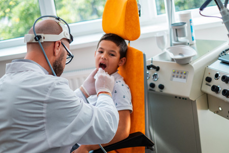 Boy at check-up at aryngologistの写真素材
