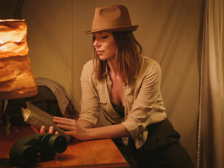 Beautiful woman in a tent at savanna, Kenyaの写真素材