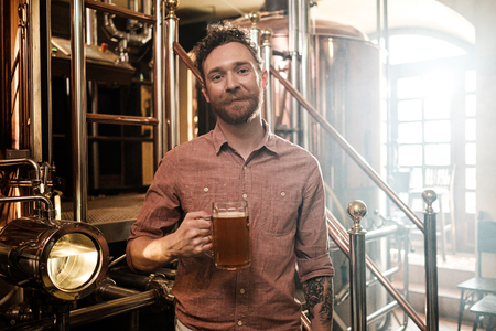Man tasting fresh beer in a breweryの写真素材