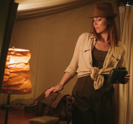 Beautiful woman in a tent at savanna, Kenyaの写真素材