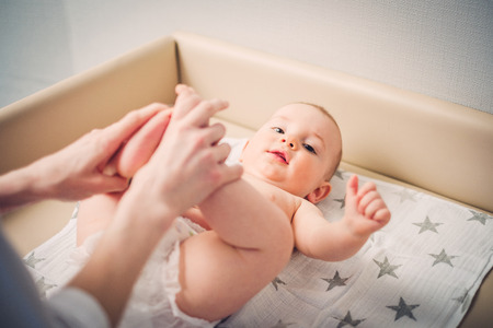 Baby boy getting a massage from masseuseの写真素材