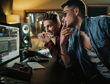 Sound engineer working in a music studioの写真素材