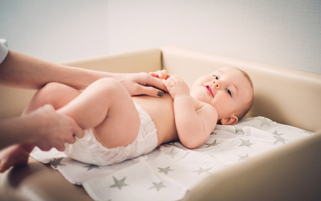 Baby boy getting a massage from masseuseの写真素材