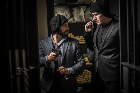Two ardmed men robbing a bankの写真素材