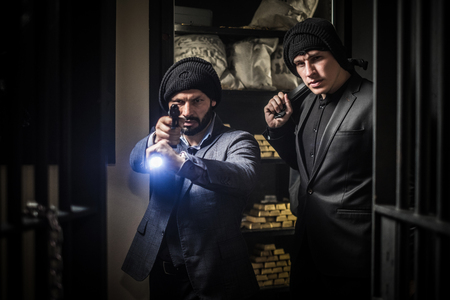 Two ardmed men robbing a bankの写真素材