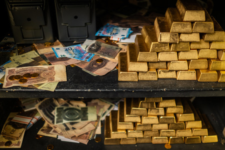 Bank vault with gold and cashの写真素材