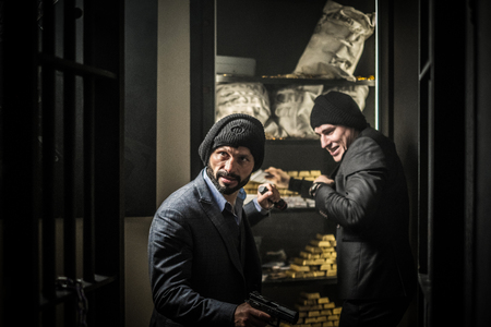 Two ardmed men robbing a bankの写真素材