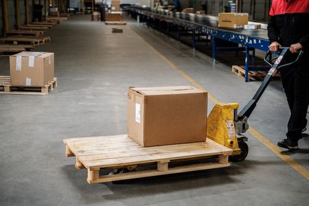 Warehouse worker with a pallet rackの写真素材
