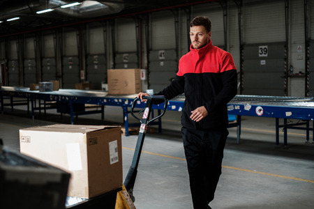 Warehouse worker with a pallet rackの写真素材