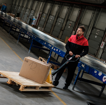 Warehouse worker with a pallet rackの写真素材