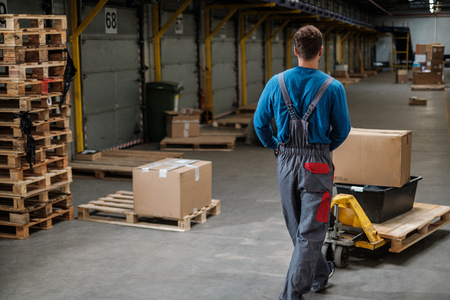 Warehouse worker with a pallet rackの写真素材