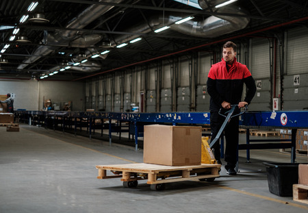 Warehouse worker with a pallet rackの写真素材