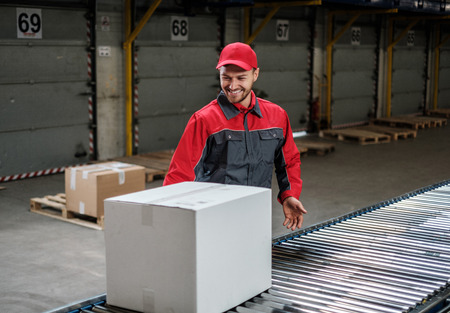 Warehouse worker working on a conveyor line