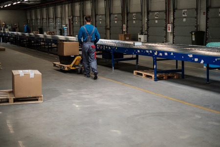Warehouse worker with a pallet rackの写真素材