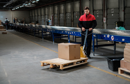 Warehouse worker with a pallet rackの写真素材
