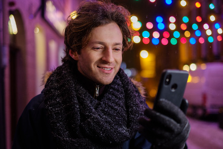 Man making selfie on a cold winter eveningの写真素材