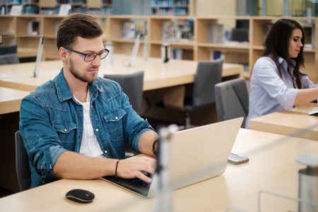Students studying in a public libraryの写真素材