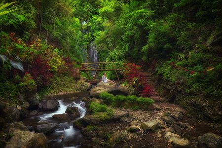 Woman near Labuhan Kebo Waterfall located in Munduk, Baliの写真素材