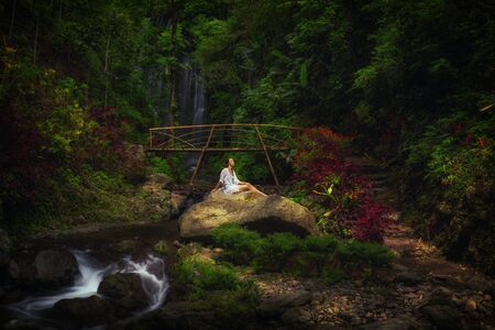 Woman near Labuhan Kebo Waterfall located in Munduk, Baliの写真素材