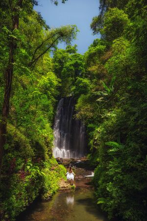 Woman near Labuhan Kebo Waterfall located in Munduk, Bali.の写真素材