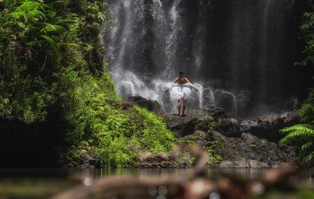 Woman near Labuhan Kebo Waterfall located in Munduk, Bali.の写真素材